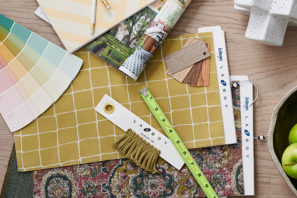 Design tools like fabric swatches, ruler, and papers